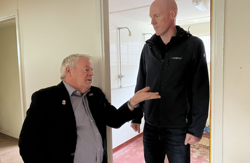 Kieran talking with Cllr Andrew Barton inside the sports pavilion