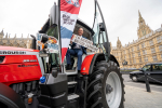 Kieran on red tractor at Parliament for Back British Farming Day