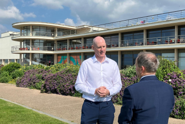 Kieran outside the De La Warr Pavilion in Bexhill talking to local councillor