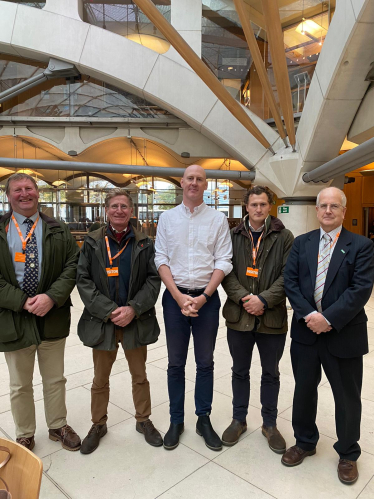 Kieran with local farmers in Parliament