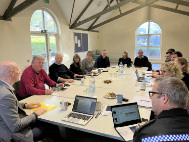 Kieran in meeting room in Robertsbridge with members of parish council, Sussex Police and National Highways